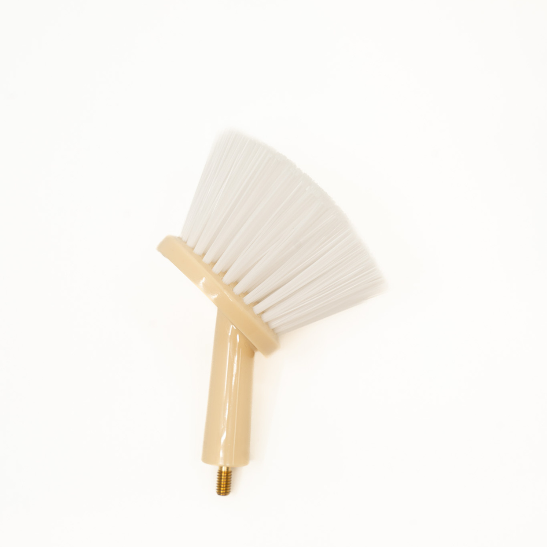 White broom with beige handle on a white background