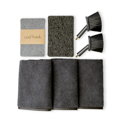 A set of kitchen sink cleaning replaceables including two brush heads, three microfiber cloths, and three sponges, all in gray color.